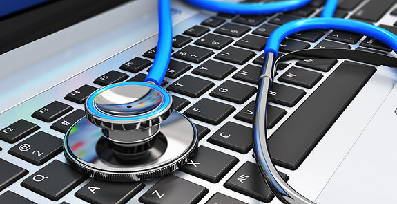 Healthcare and medicine or computer antivirus protection and repair maintenance service concept: macro view of blue stethoscope on business office laptop notebook keyboard with selective focus effect